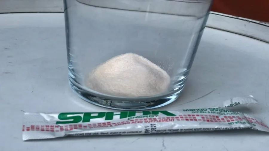 Advocare Spark energy powder in a glass