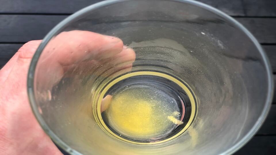 Advocare Spark powder undissolved in the bottom of a glass