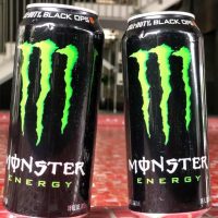 Two 16 fluid ounce cans of Monster energy drink