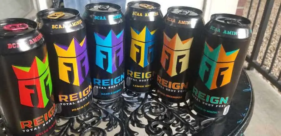Different flavors of Reign energy drink arranged on the table.
