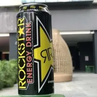 can of rockstar on a bench