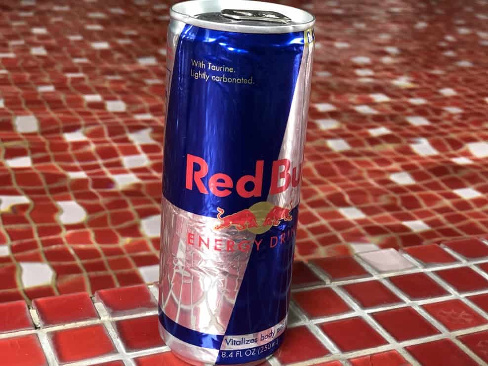 Red bull can on red tile