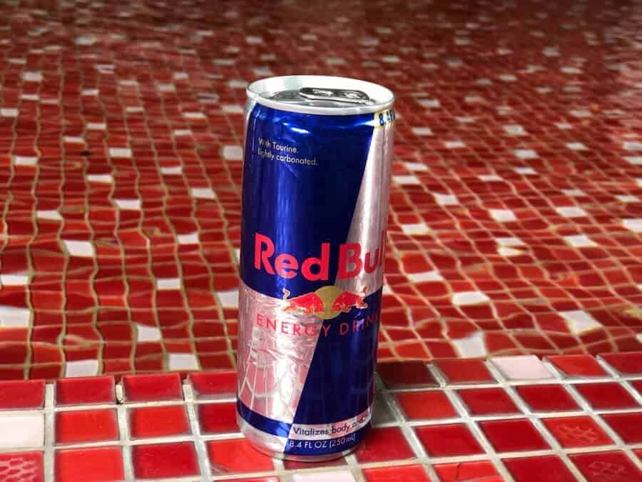 A can of Red Bull by the pool