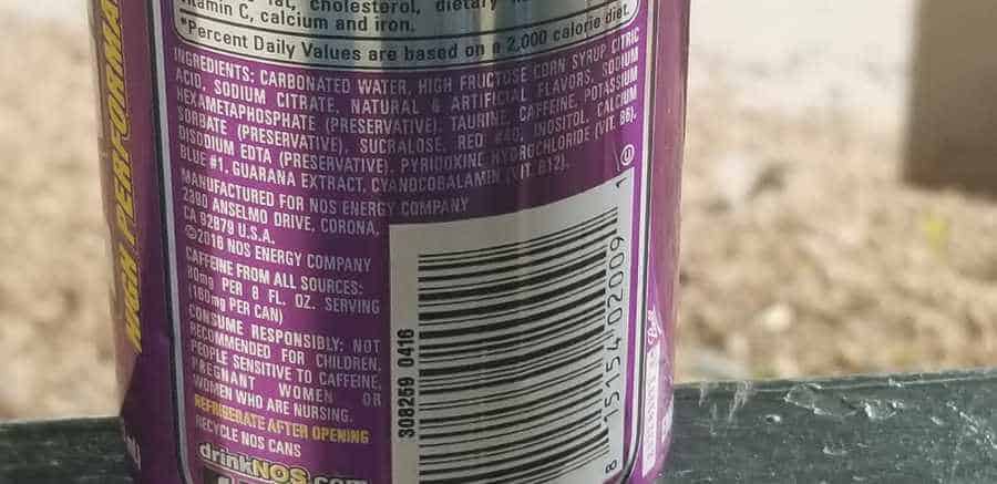 Ingredients label on the back of NOS energy drink can.