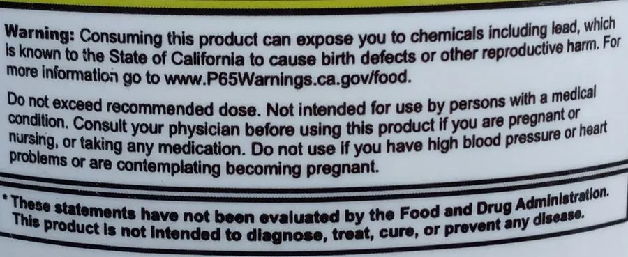 The lead warning label behind a  G Fuel tub. 