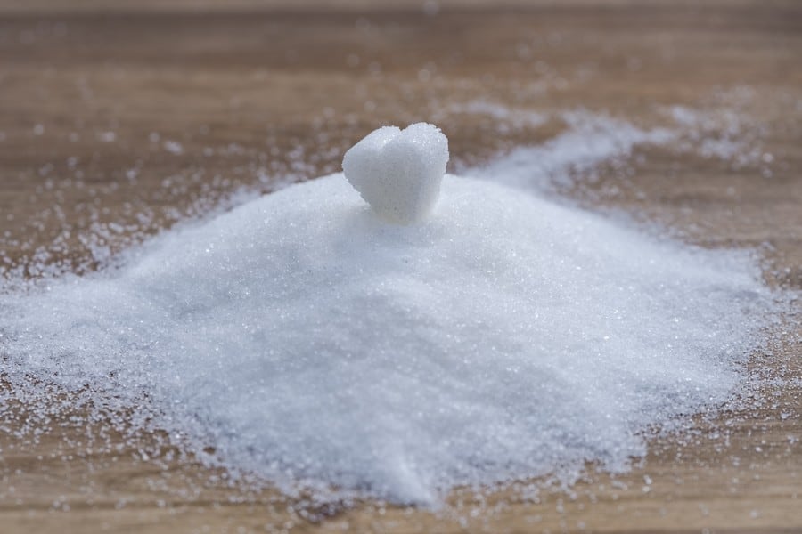 A sugar heart atop a sugar pile. 