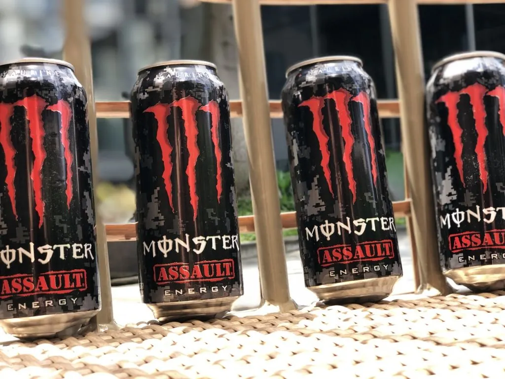 Four cans of Monster Energy Drinks in full view.
