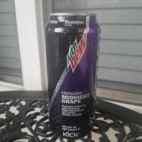 A picture of a can of Mountain Dew Kickstart in full view on a table.