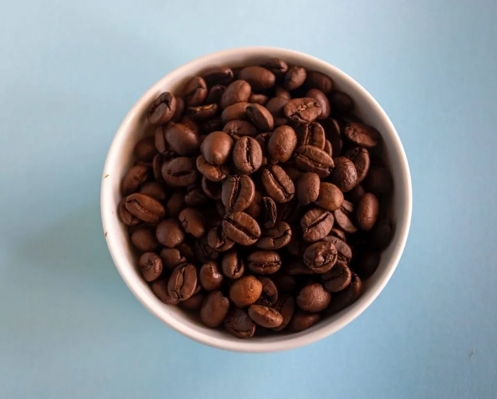 Top view of a bowl of coffee beans. 