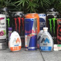 Different brands of energy drinks in a row.