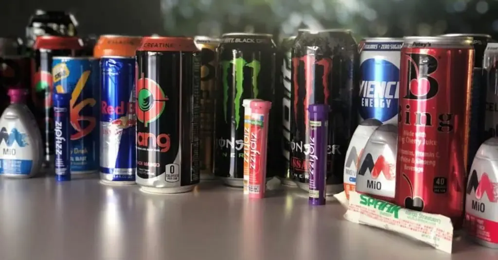 A wide array of energy drinks on the table.