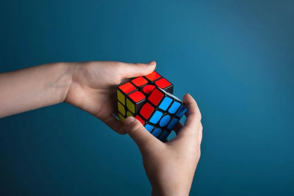 A picture of a person playing magic cube
