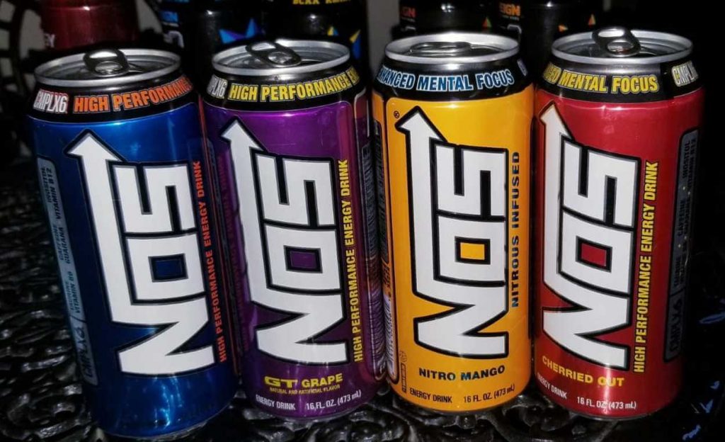 A picture of four cans of NOS Energy Drink