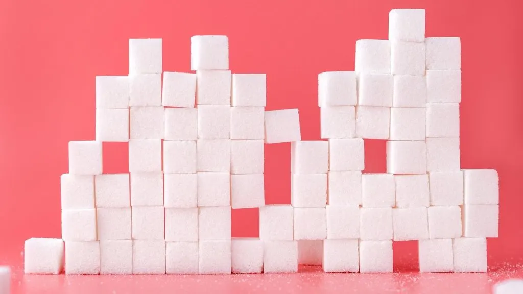 Sugar cubes piled into a tower. 