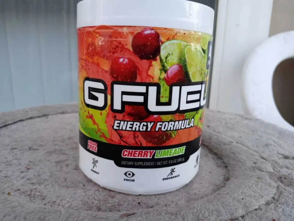A tub of G Fuel on a table in full view.
