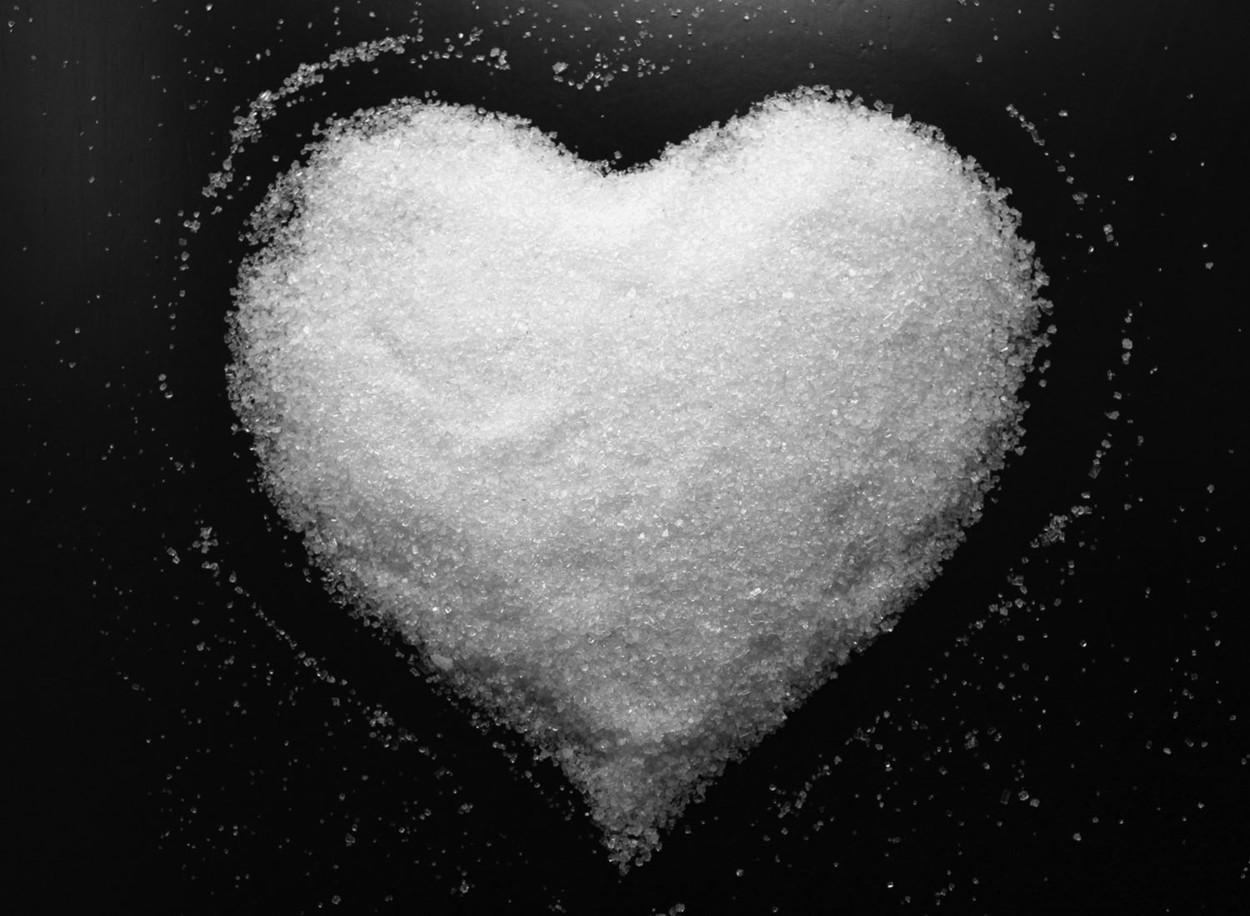 Heart-shaped pile of sugar.