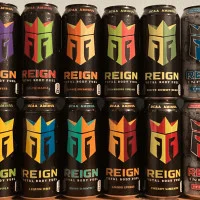 Reign energy drink cans stacked