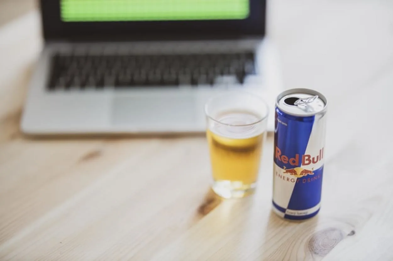 red bull in front of a laptop