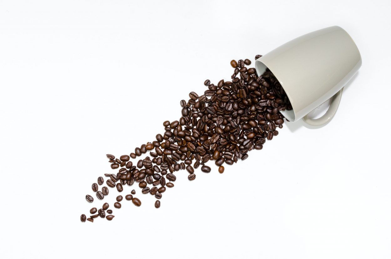 A spilled cup of coffee beans