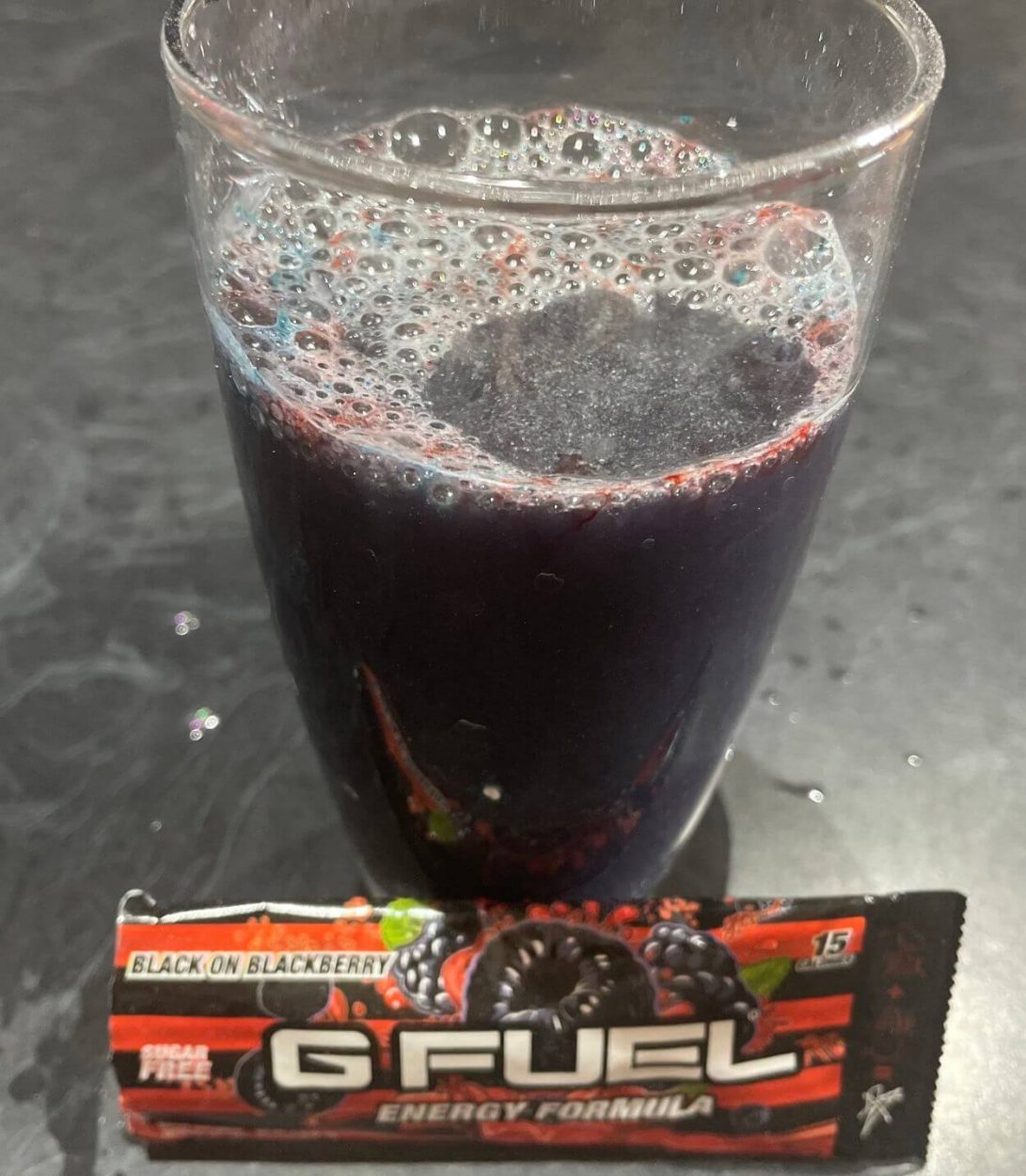 Black on Blackberry G Fuel flavor in a glass