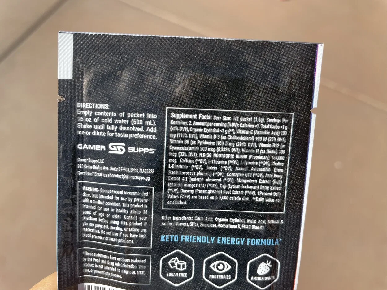 A photo showing the back part of a GG energy drink sachet.