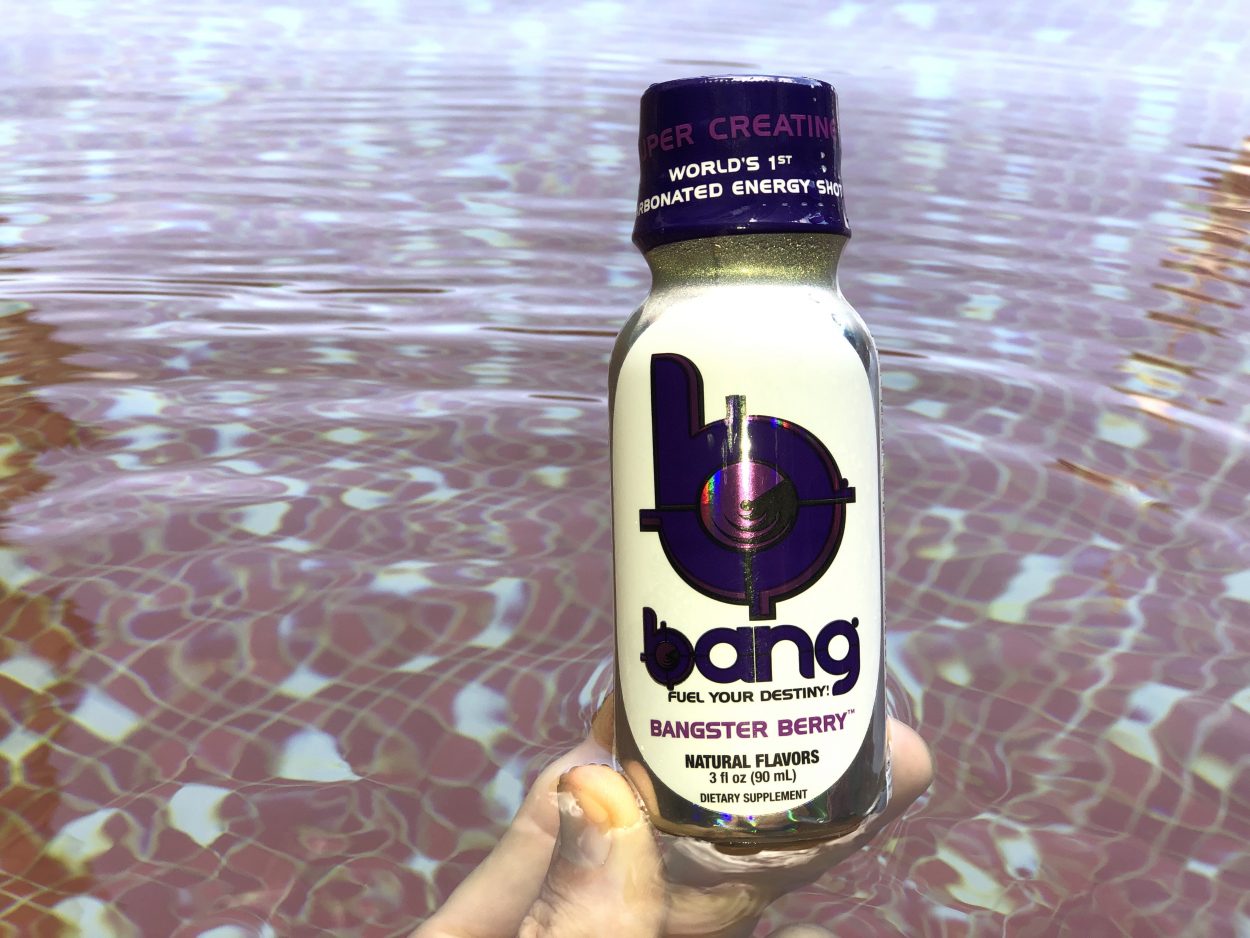 Bang Energy Shot bottle in a pool