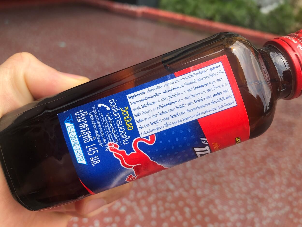 Label printed on the side of a small bottle of Krating Daeng Energy Drink.