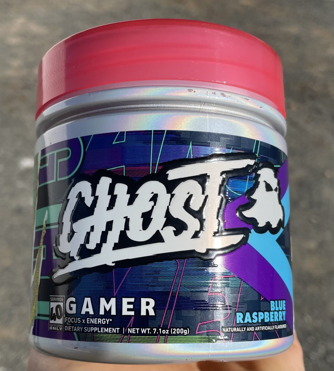 A tub of Ghost Gamer energy drink blue raspberry flavor.
