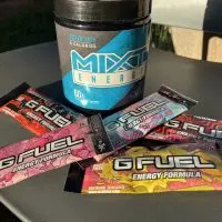 Tub of MIXT and packs of G Fuel