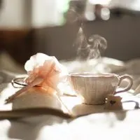 Paper, pen and tea cup